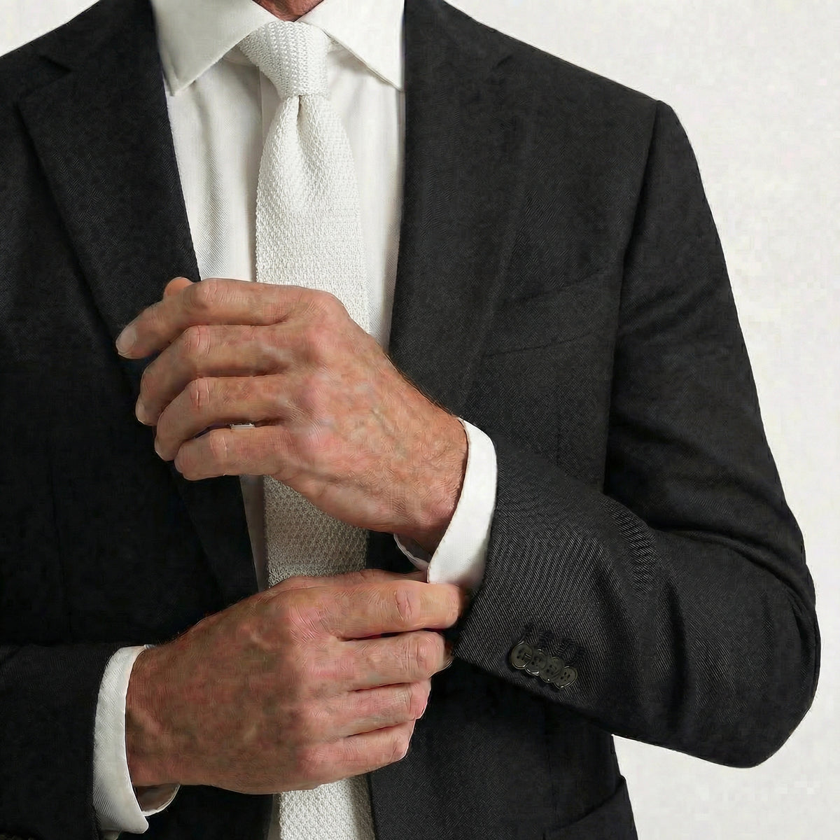White Handmade 3-Fold Grenadine Silk Tie, worn with a suit and shirt