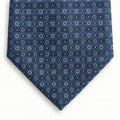 blue jacquard silk tie with circular geometric micro-pattern, made in Como, Italy