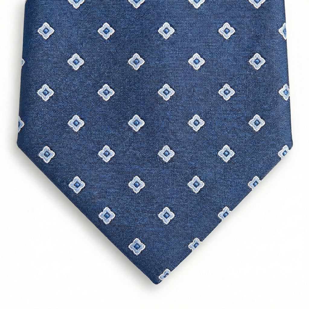 blue jacquard silk tie with small geometric foulard pattern, handmade in Como