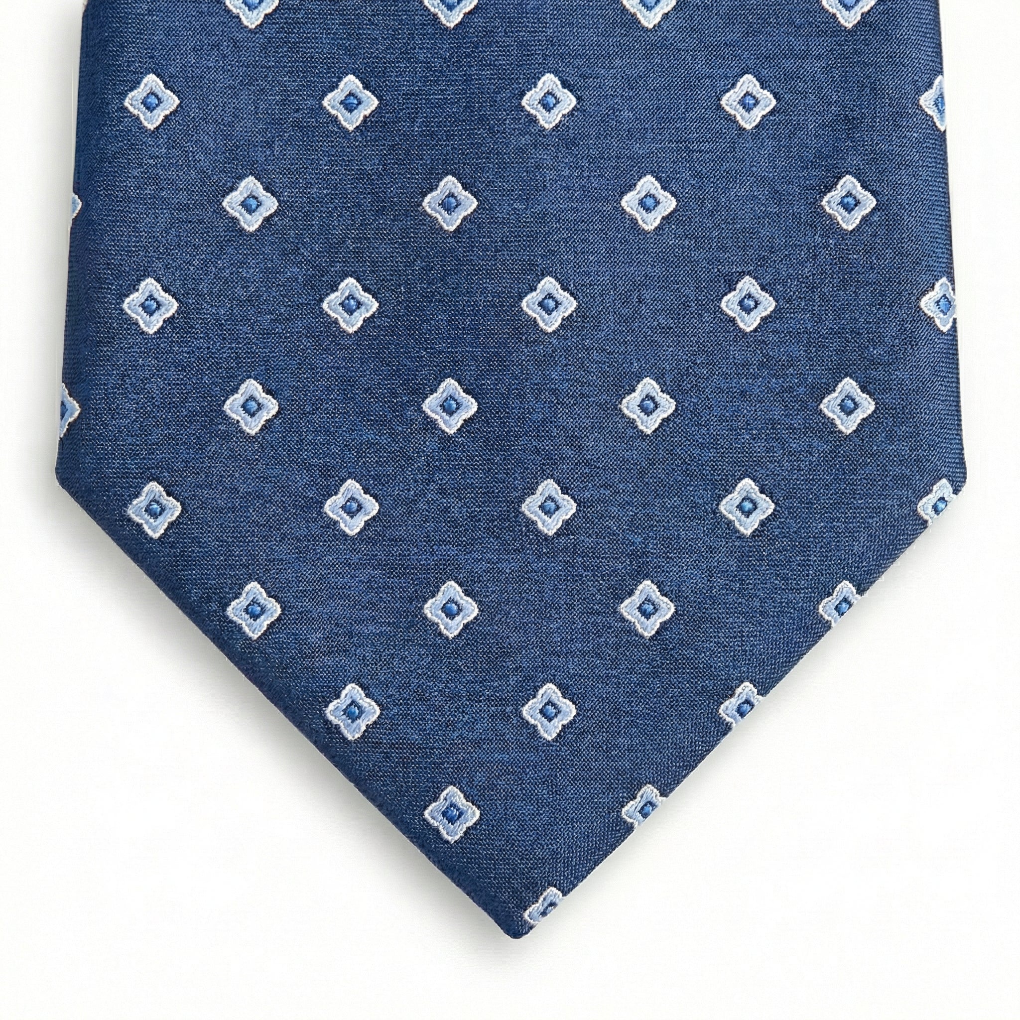 blue jacquard silk tie with small geometric foulard pattern, handmade in Como