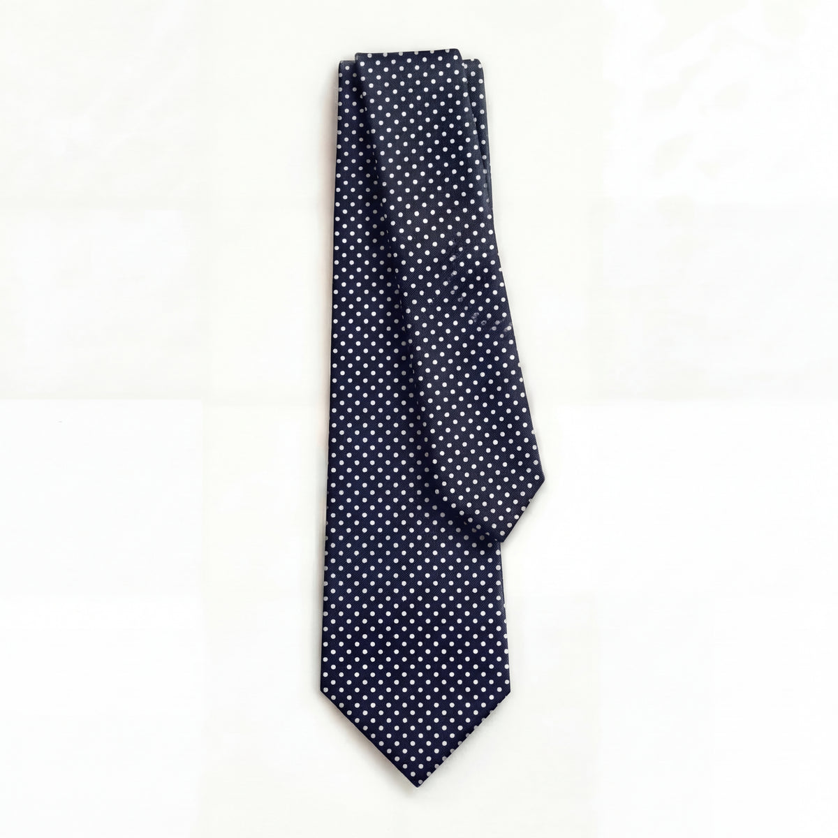 DARK BLUE 3 FOLD SARTORIAL SILK TIE - White Polka Dot, full tie displayed on white background